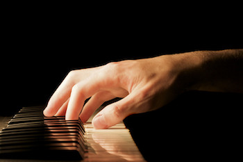 Pianist playing a chord